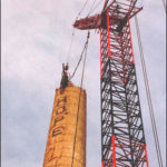 Crane Removing Top of Smokestack